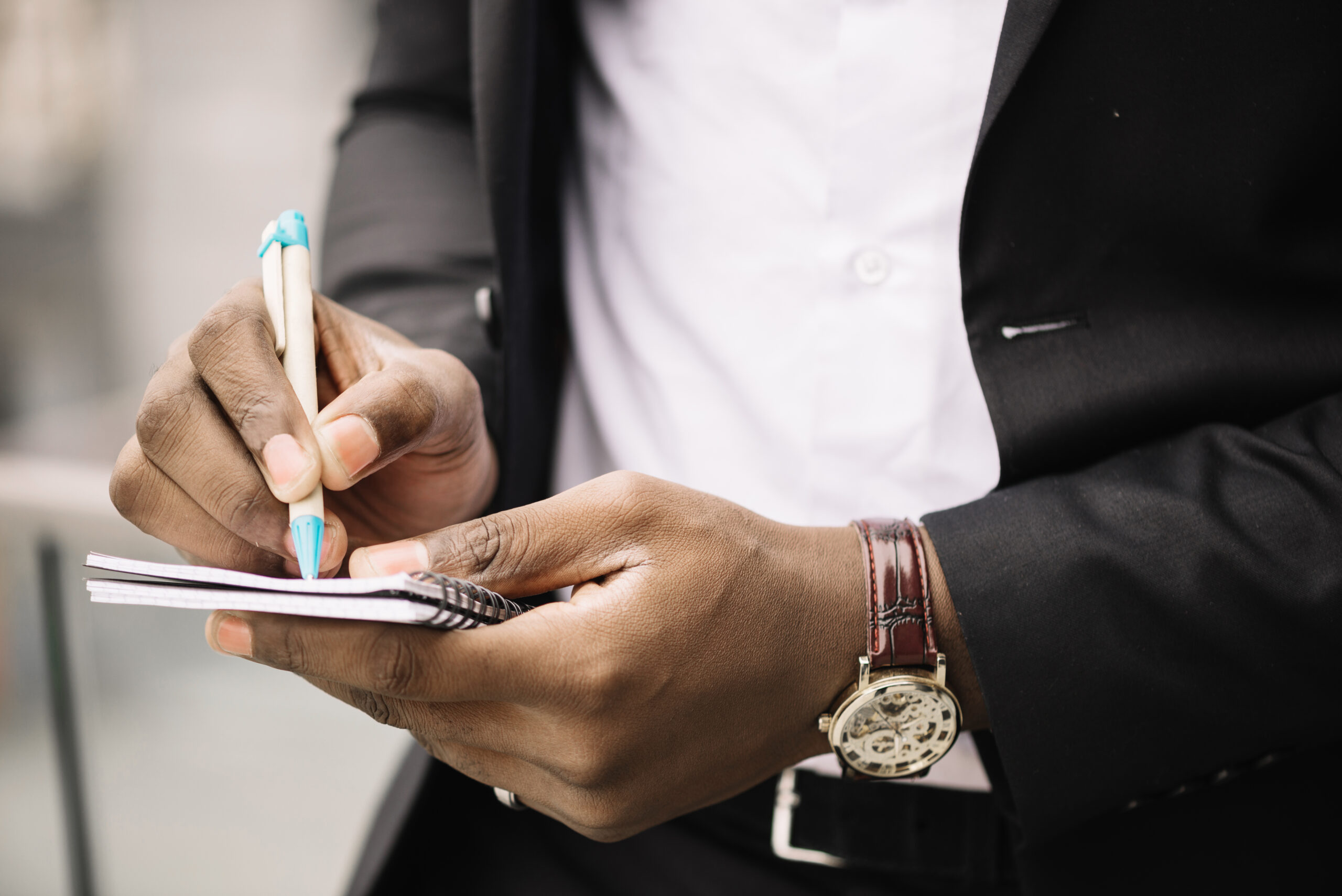 crop man writing note