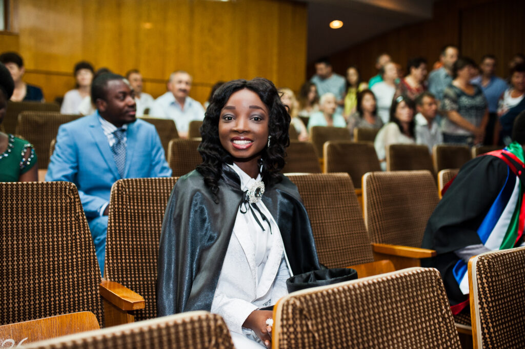 happy beautiful black african american girl with hat and gown gr