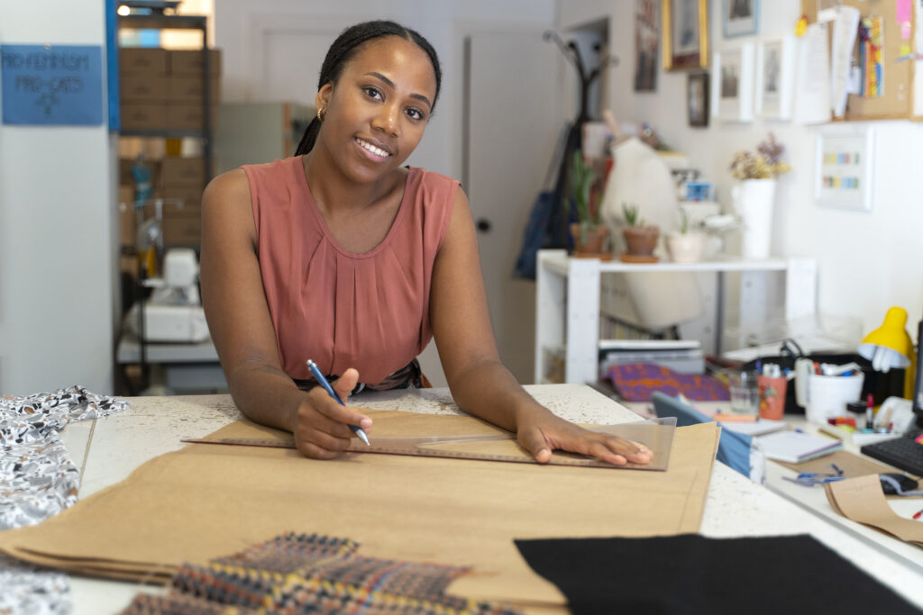 medium shot black woman running small business (1)